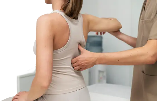 A woman getting her spine checked